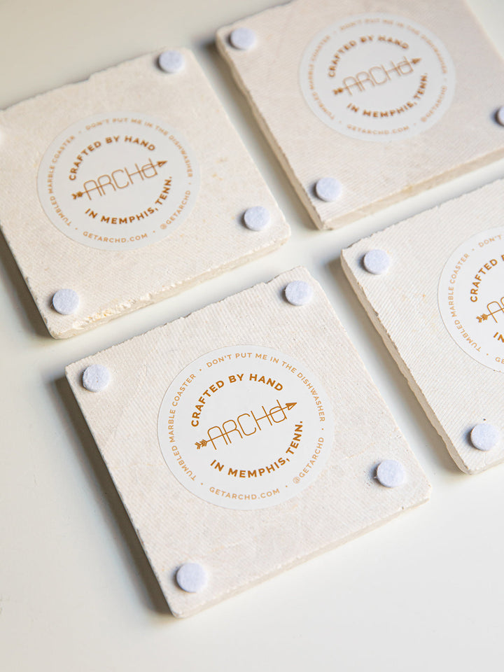 Back view of ARCHd marble coasters with branded sticker and do not put in dishwasher