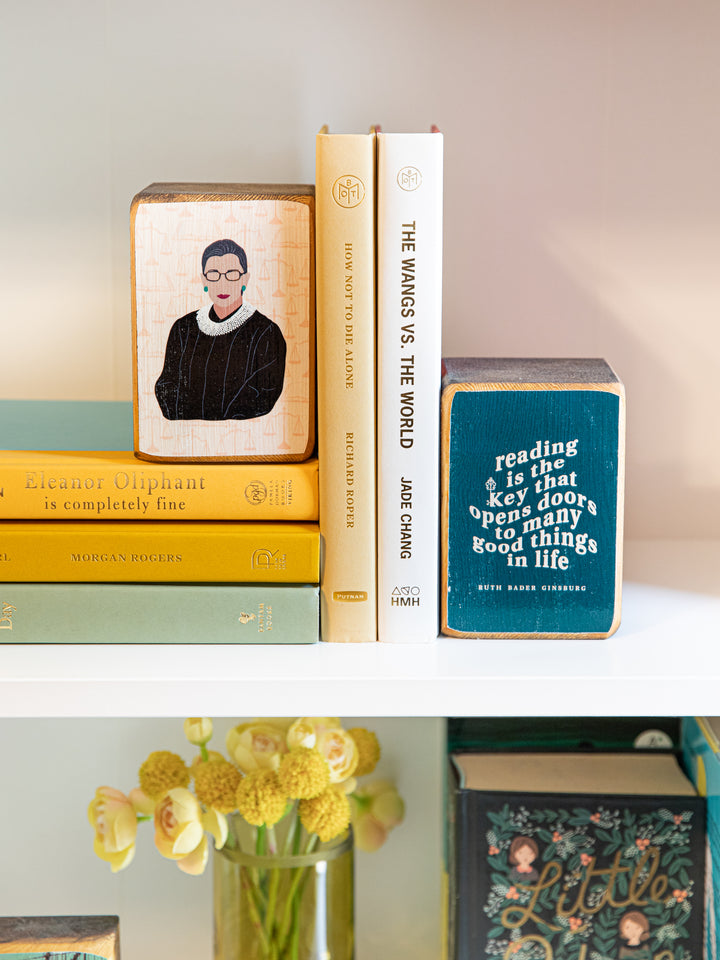 Ruth Bader Ginsburg reading bookends on white shelf. Ruth Bader Ginsburg art
