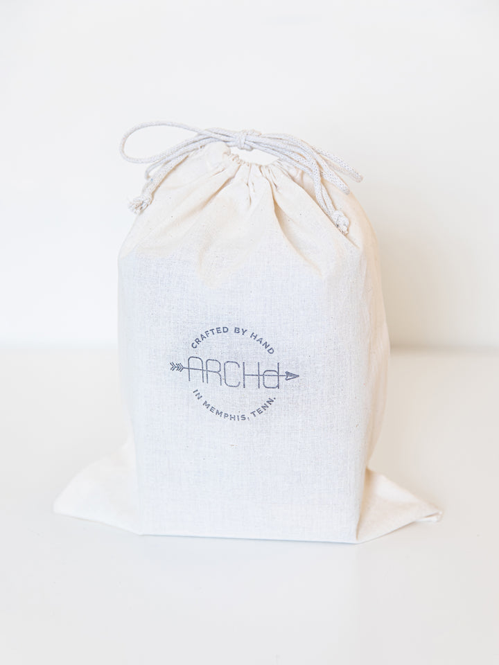 ARCHd bookend set branded product packaging Cotton muslin Bag with drawstring