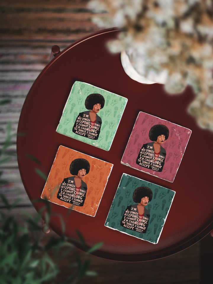 coaster set on red table. Angela Davis art