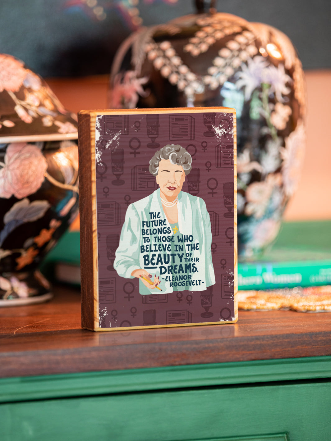Image transfer on wood of Original illustration of Eleanor Roosevelt with her quote, "The future belongs to those who believe in the beauty of their dreams." on side table by yellow chair. Eleanor Roosevelt art