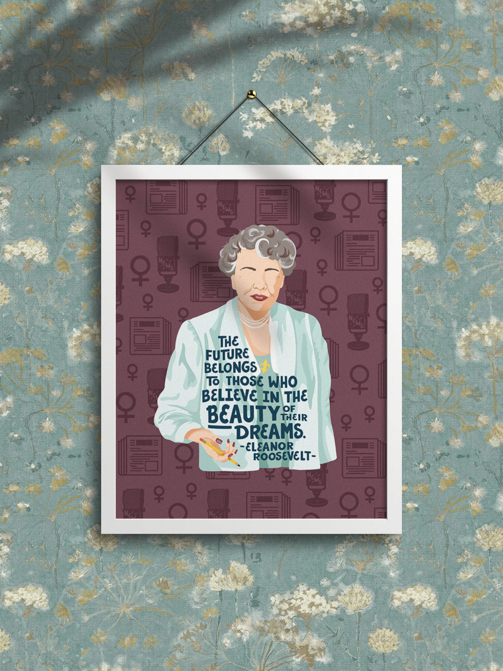 Eleanor Roosevelt Quote The Future belongs to those who believe in the beauty of their dreams_8x10 wall art hanging in white frame on teal floral wallpapered wall. Eleanor Roosevelt art