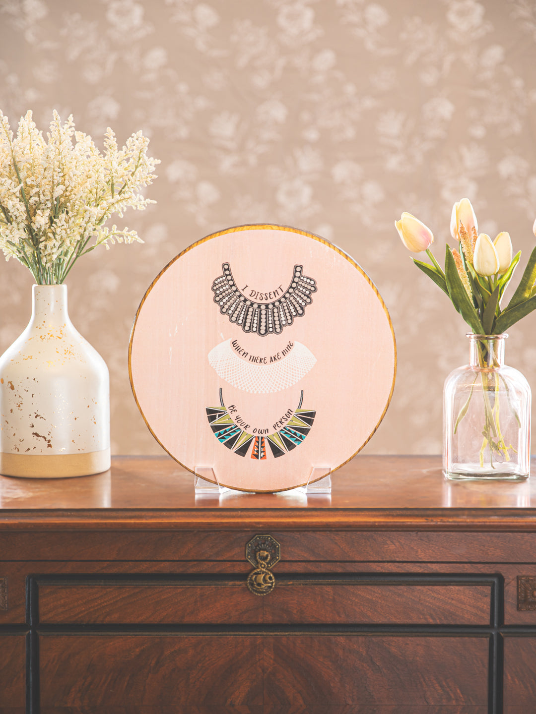 wood round rbg collar art on table top. Ruth Bader Ginsburg art
