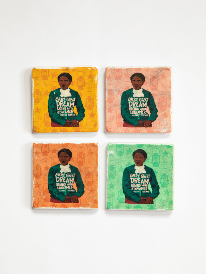 Set of 4 marble coasters on white background. Each coaster depicts the same illustration of Harriet Tubman each with a different colored background. Yellow, pink, orange, and green. harriet tubman art