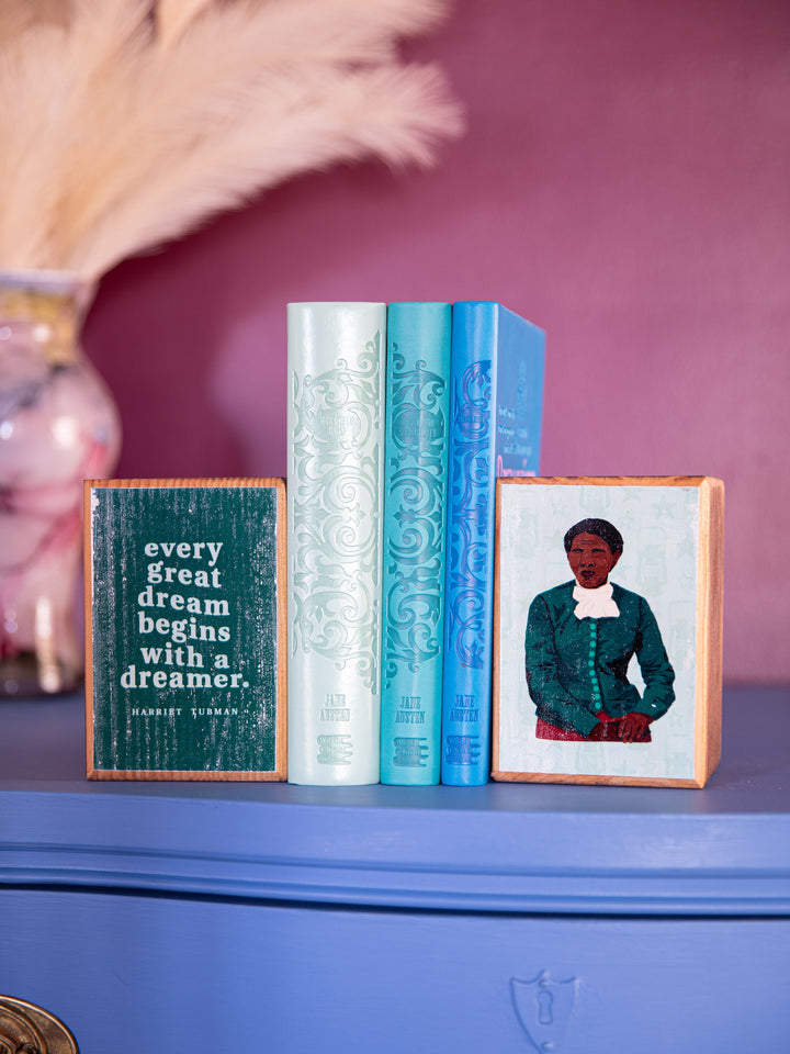 Lifestyle photo of bookend set on table top holding up books. harriet tubman art