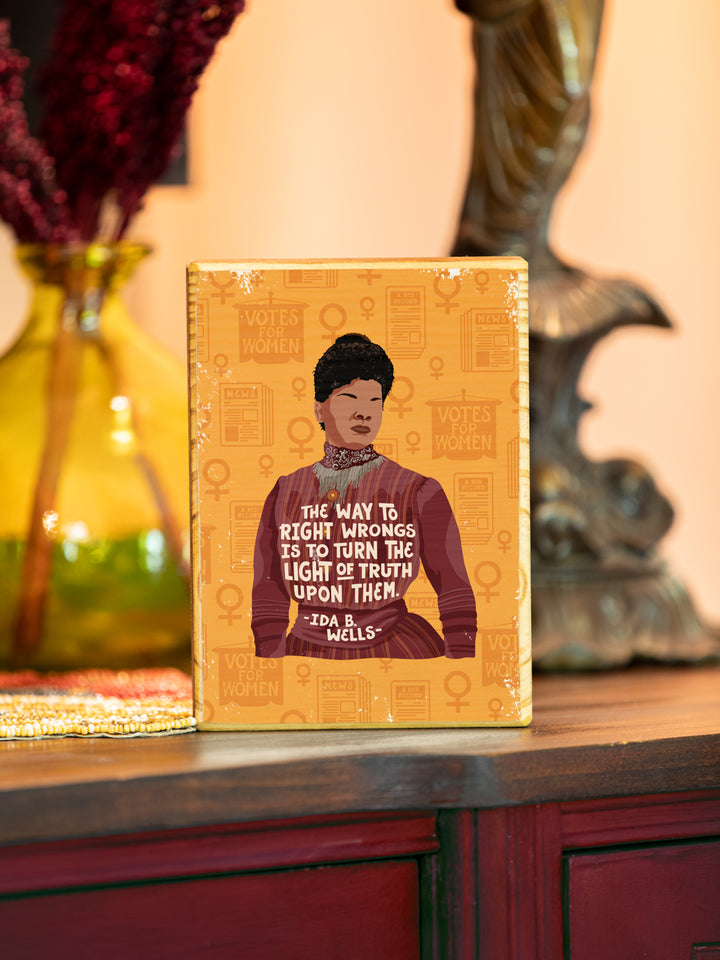 Original illustration of Ida B. Wells with her quote, "The way to right wrongs is to turn the light of truth upon them." image transfer on wood on red painted buffet. ida b wells art