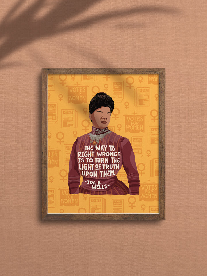 Original illustration of Ida B. Wells with her quote, "The way to right wrongs is to turn the light of truth upon them." wall art framed in an oak frame on a mauve wall. ida b wells art
