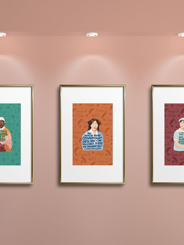 Gallery style wall with several prints. Sojourner truth to the left, Louisa May Alcott in the center, and Jane Austen to the right. Louisa May Alcott gifts