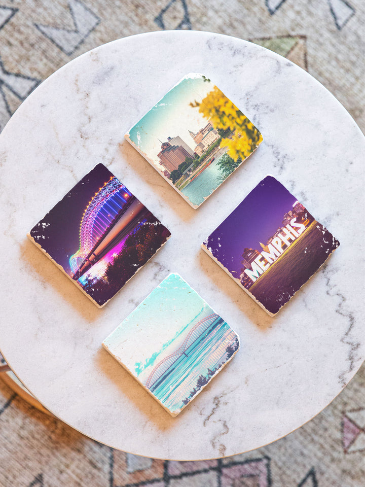 Memphis bridge and downtown skyline views on marble coaster set, shown on marble table