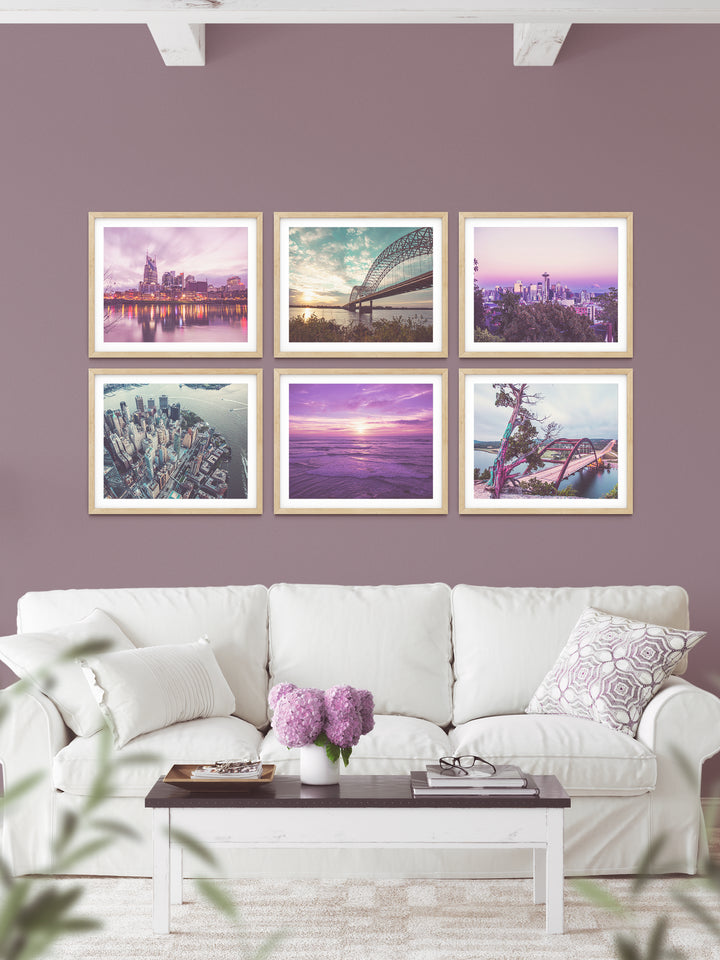 Large photography print gallery wall: Nashville skyline, Memphis bridge, Seattle space needle, New York aerial skyline, San Diego beach, Austin 360 bridge lookout