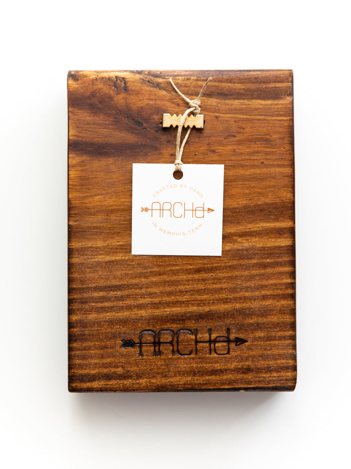 back view of ARCHd wood art with brand, tag and sawtooth hanger