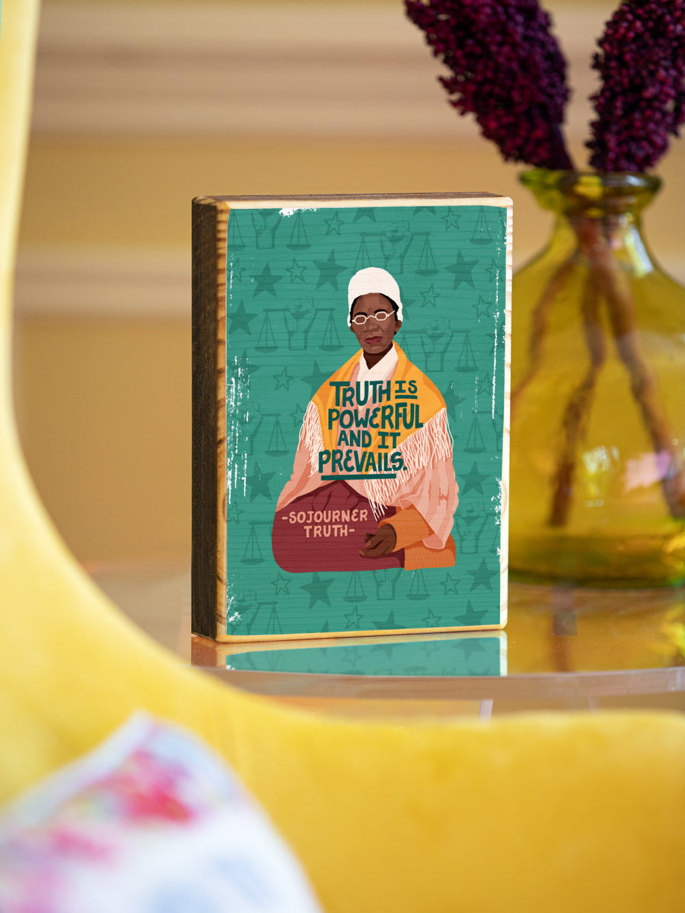 Sojourner Truth 5x7 wood art on acrylic table beside yellow chair. Sojourner Truth art