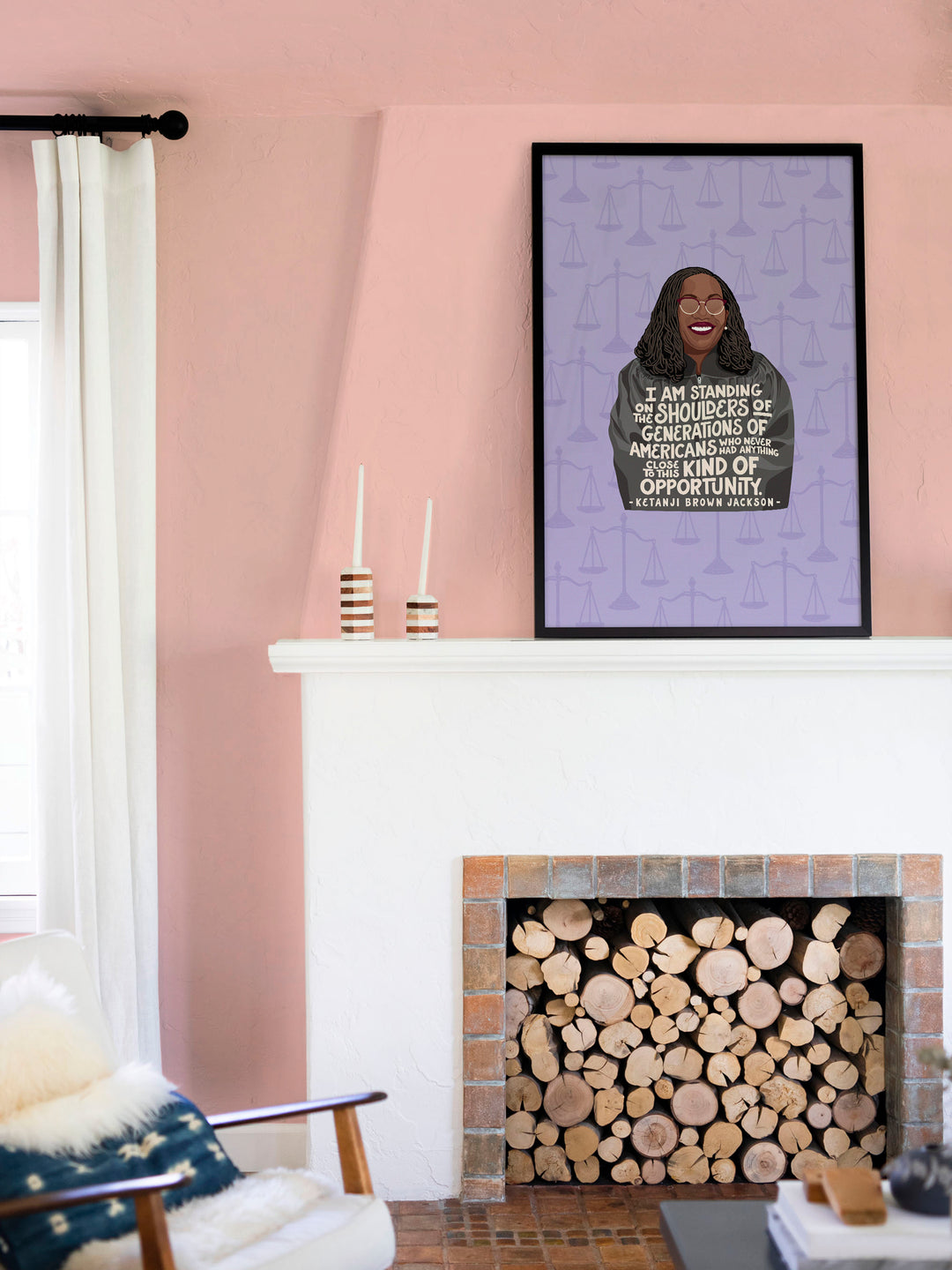 framed print hanging above a wood filled fireplace. Ketanji Brown Jackson art