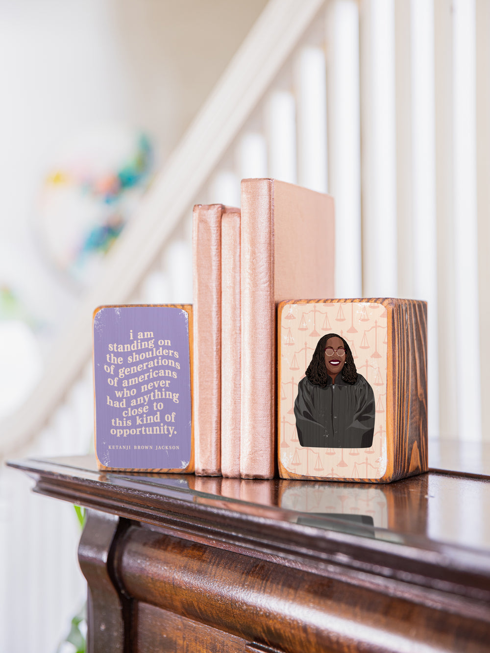 Judge Ketanji Brown Jackson bookend set on the top of a piano holding copper books. Ketanji Brown Jackson art