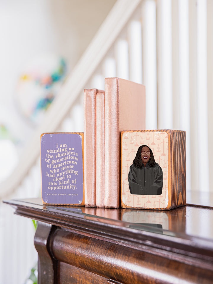 Judge Ketanji Brown Jackson bookend set on the top of a piano holding copper books. Ketanji Brown Jackson art