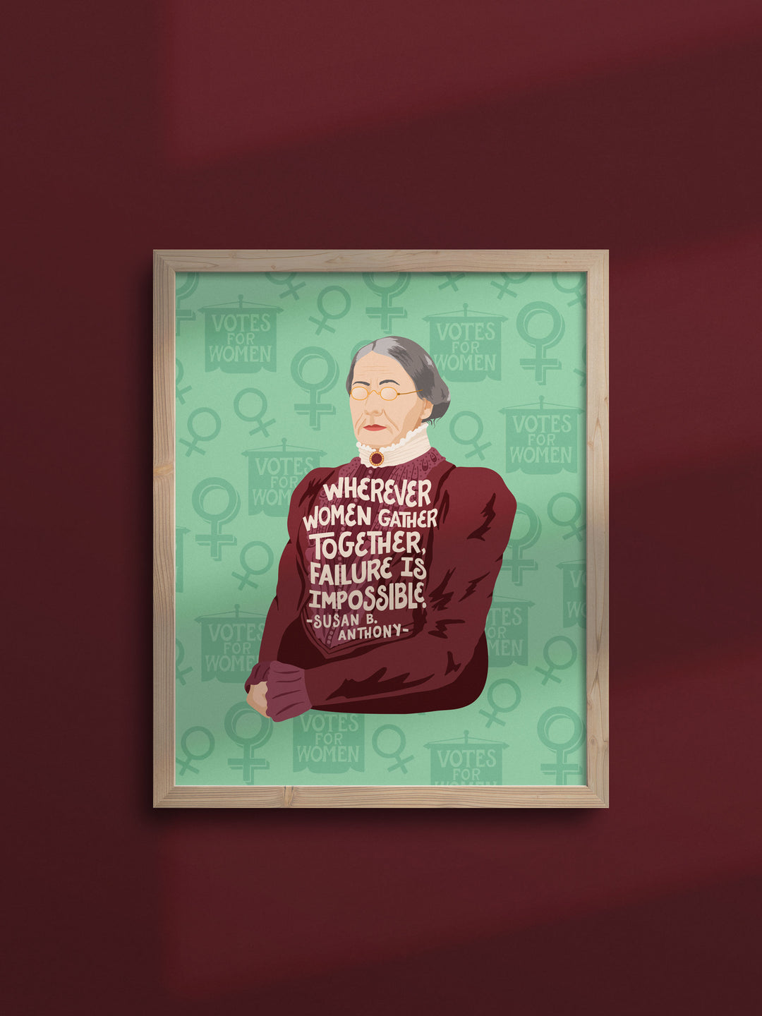 Susan B. Anthony illustrated art print in wood frame on deep red wall with shadow. Susan B Anthony art