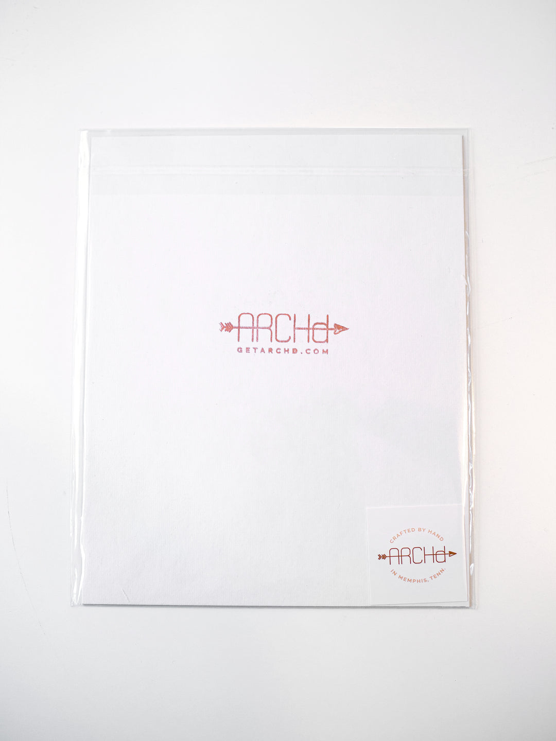 Art print packaging in clear bag with ARCHd branding