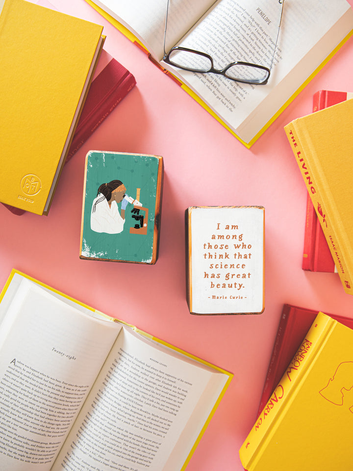 woman scientist with microscope illustration and Marie Curie quote, "I am among those who think that science has great beauty." on wood bookends