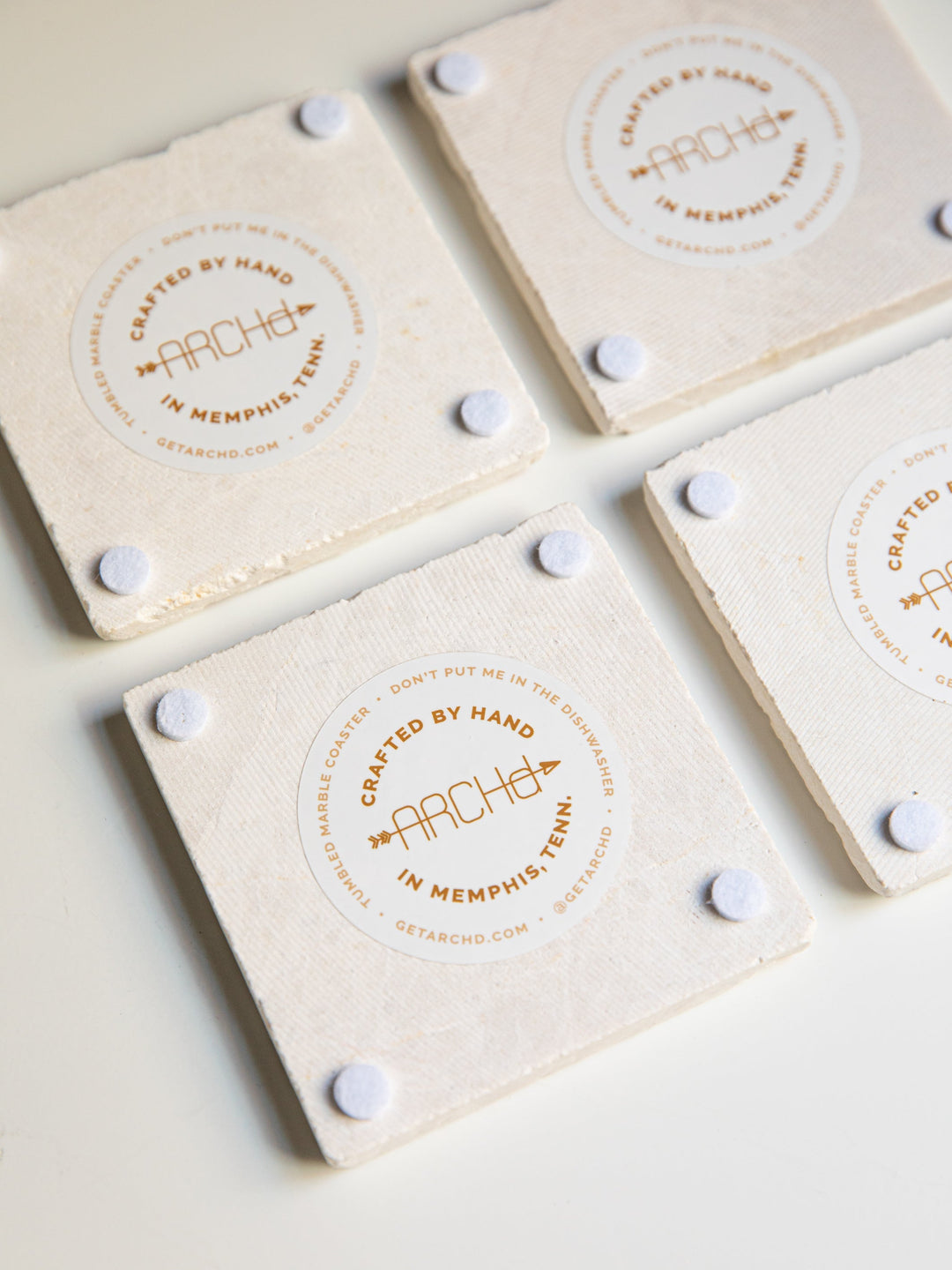 back view of coasters with sticker label and padded feet