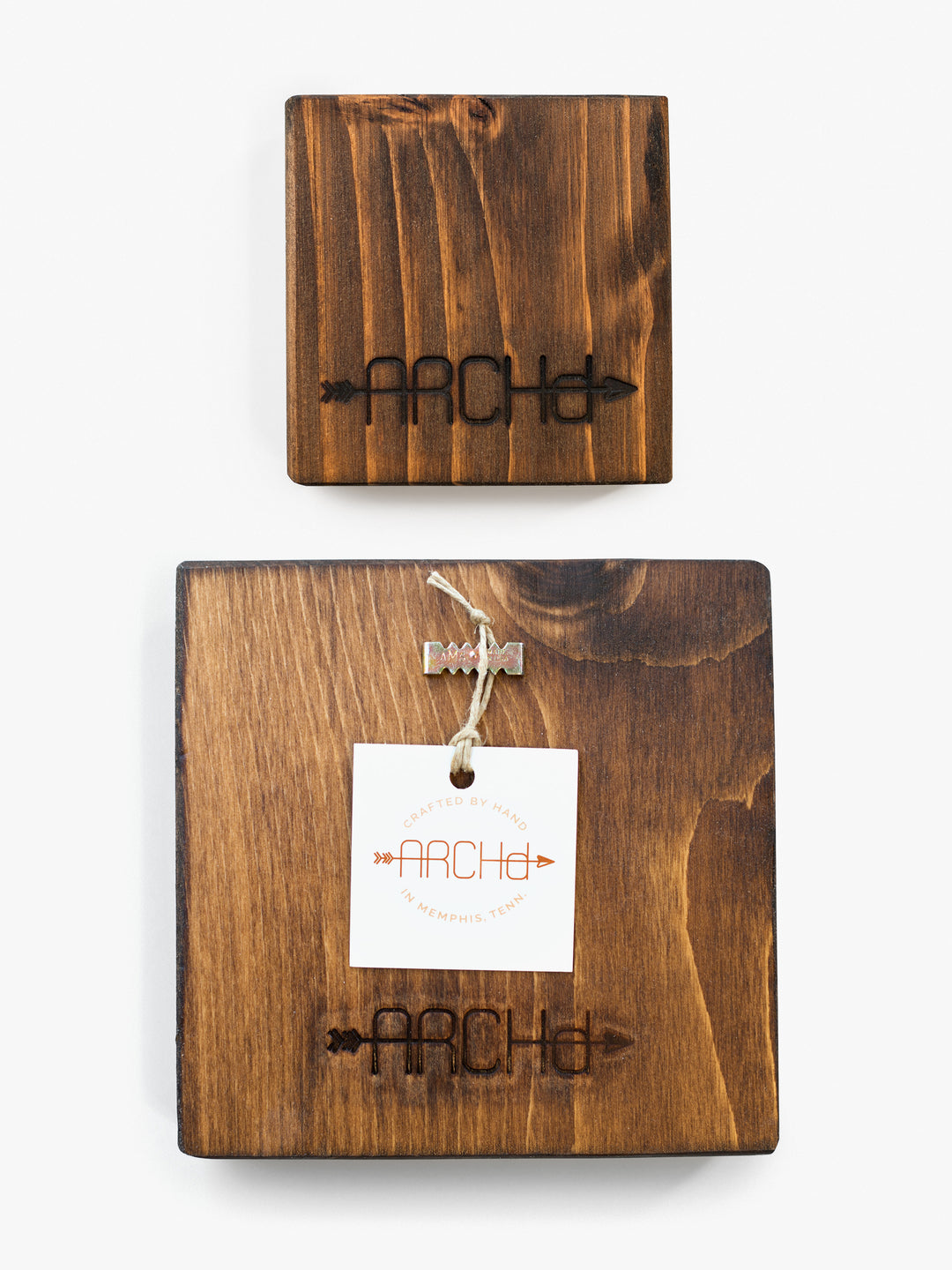 Back view of ARCHd wood art with branding iron logo, sawtooth hanger and business card